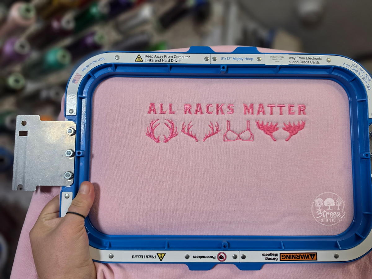 All Racks Matter embroidered on light pink Gildan crewneck